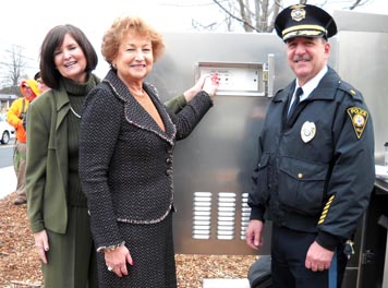 Freeholder Director Barbara McMorrow switches the new traffic signal on in West Long Branch